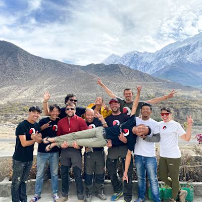 Nepal team with logo and mountains in the background